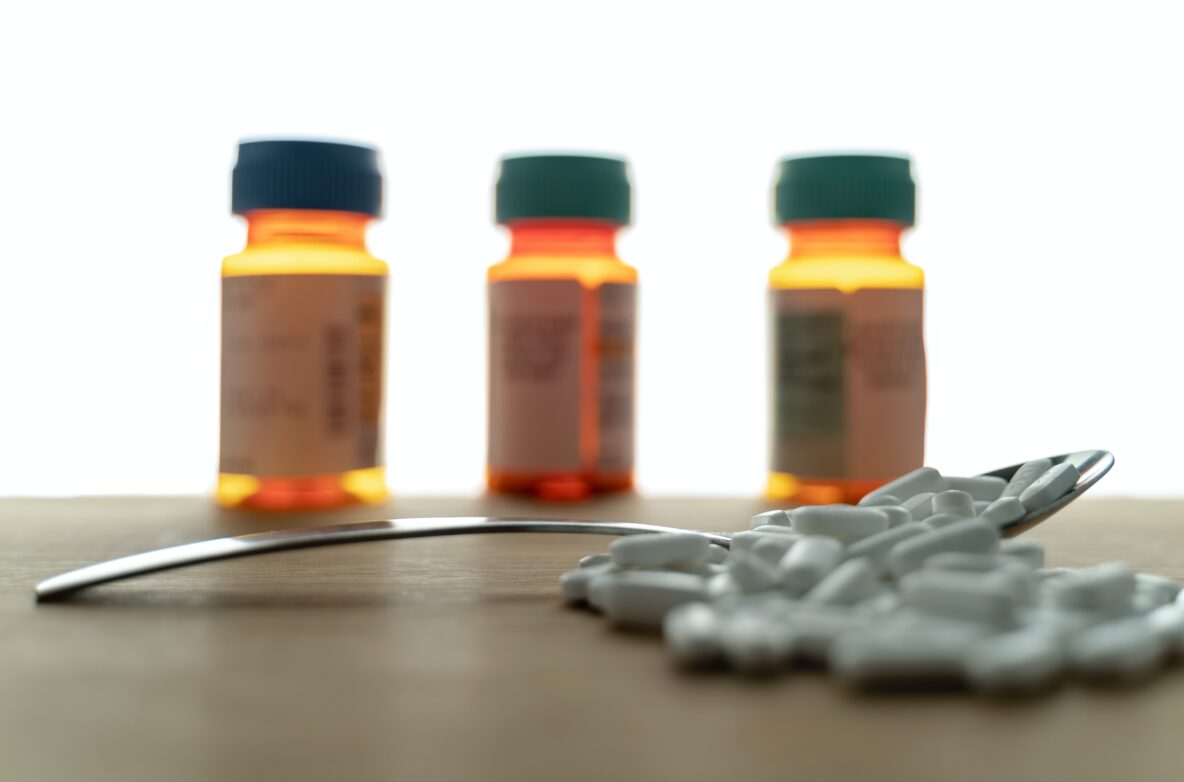 Photo: Pill bottles and white pills